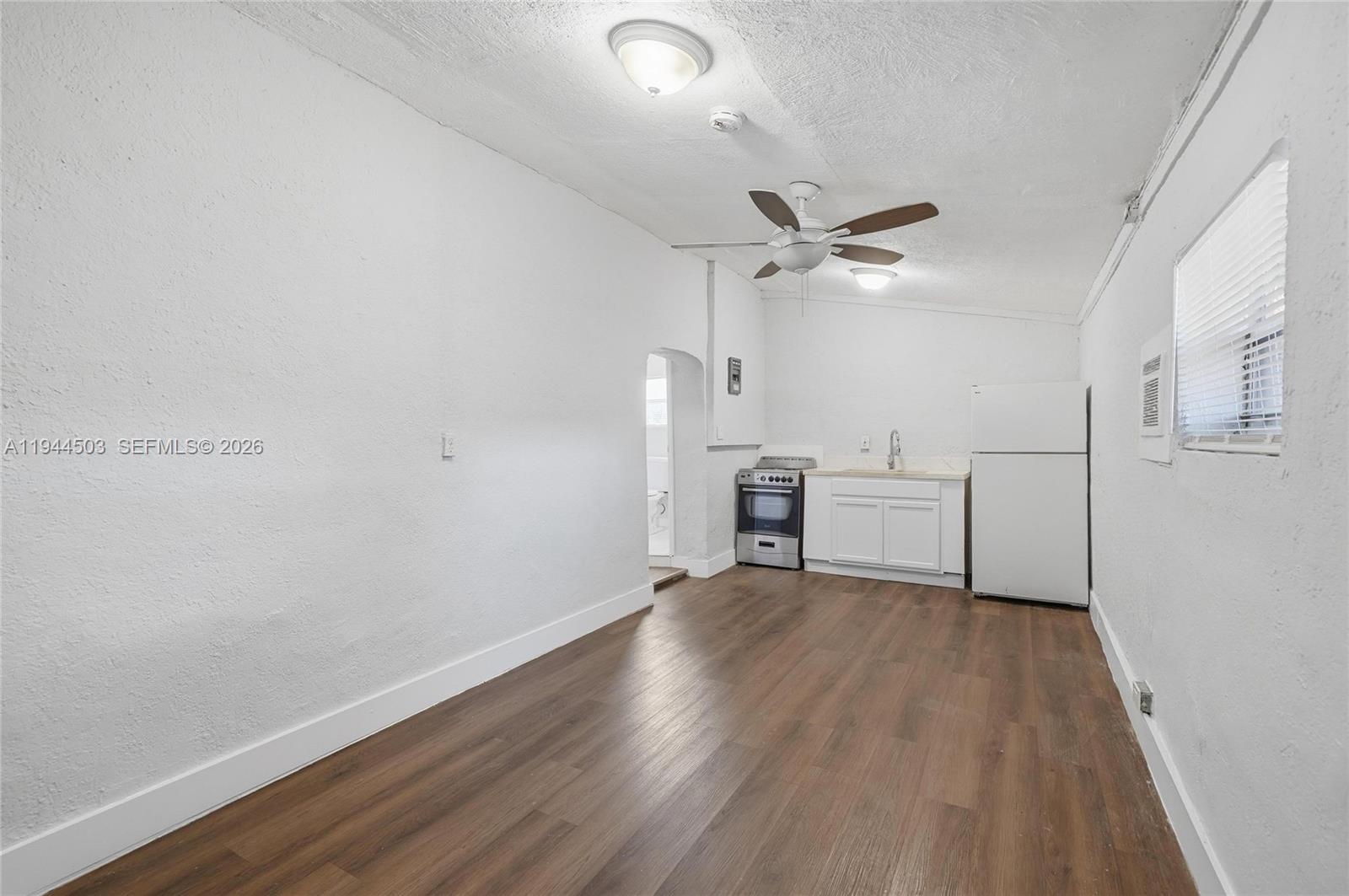 5401 Southwest 20th Street, Unit B West Park, FL 33023 - Photo 3 of 10 wooden floor in an empty room