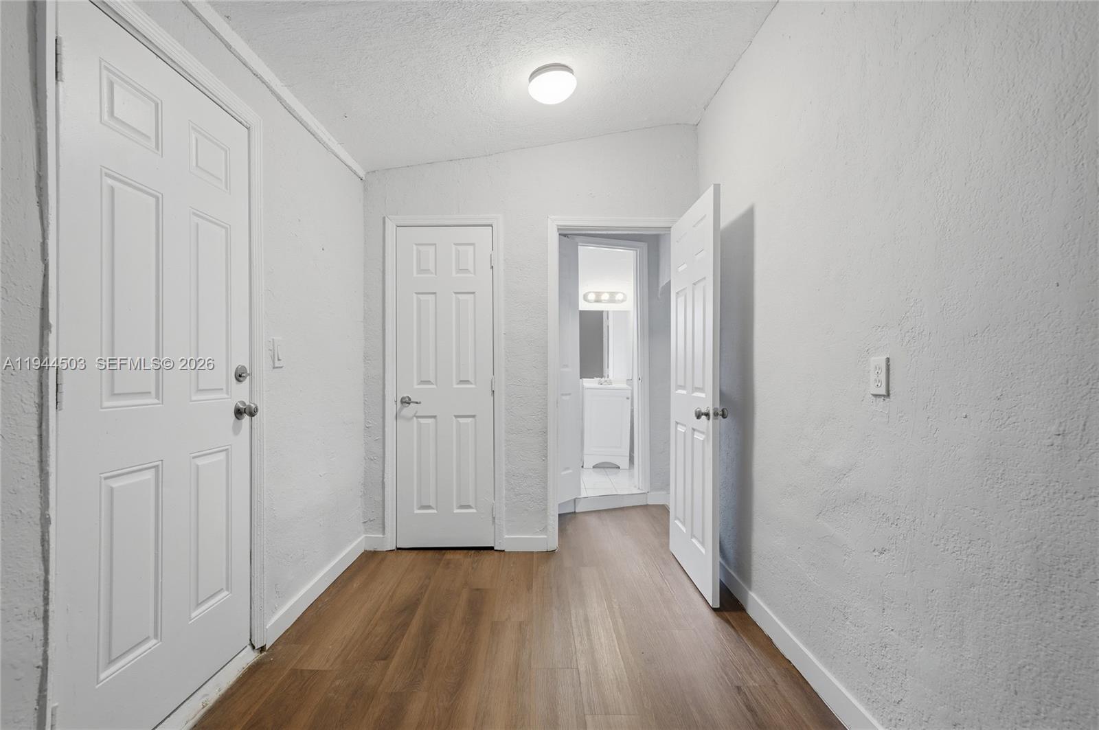 5401 Southwest 20th Street, Unit B West Park, FL 33023 - Photo 8 of 10 a view of a hallway with wooden floor
