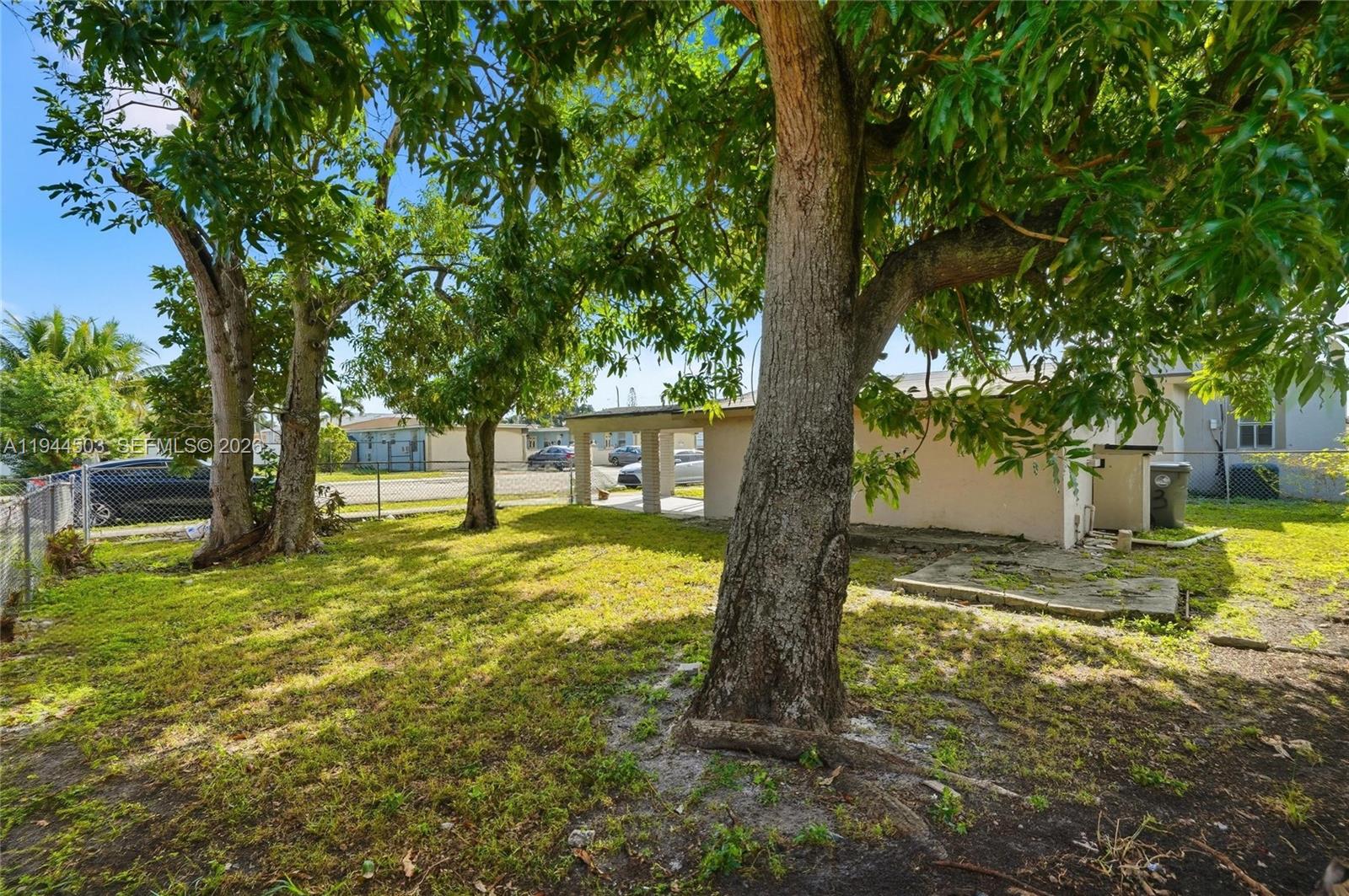 5401 Southwest 20th Street, Unit B West Park, FL 33023 - Photo 9 of 10 a view of a yard with plants and trees