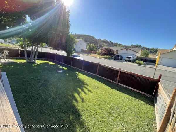 a view of a backyard with plants
