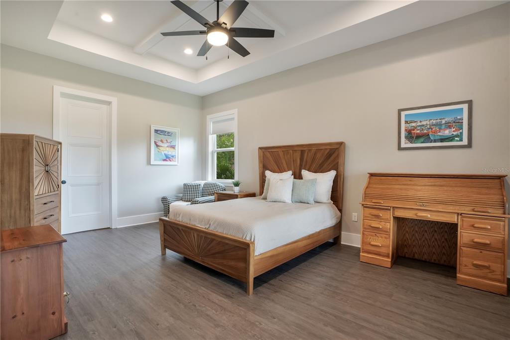 440 Palma Ceia Road Winter Haven, FL 33884 - Photo 29 of 78 a bedroom with a bed and a fireplace