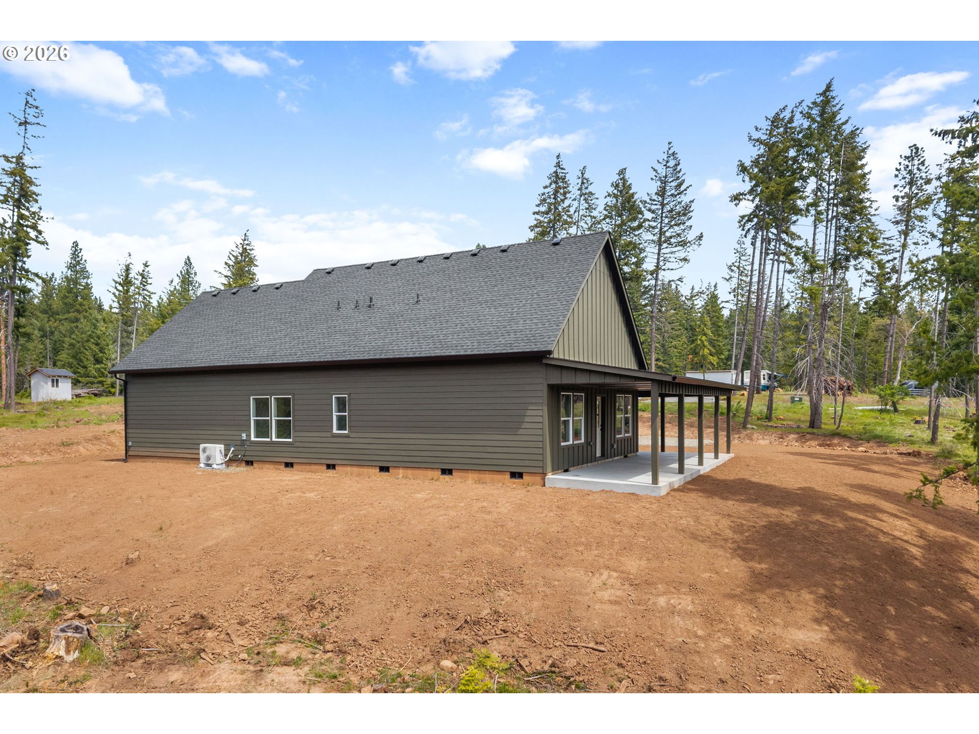 16 Snag Road Lyle, WA 98635 - Photo 29 of 43 a front view of a house with large trees