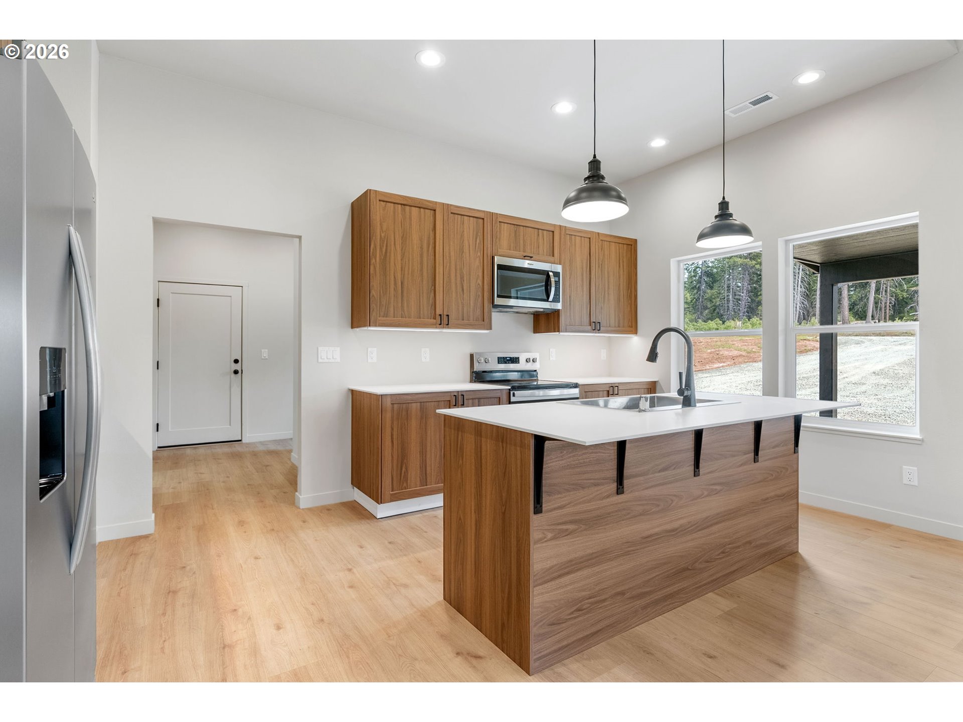 16 Snag Road Lyle, WA 98635 - Photo 6 of 43 a open kitchen with granite countertop a sink dishwasher a refrigerator with wooden floor