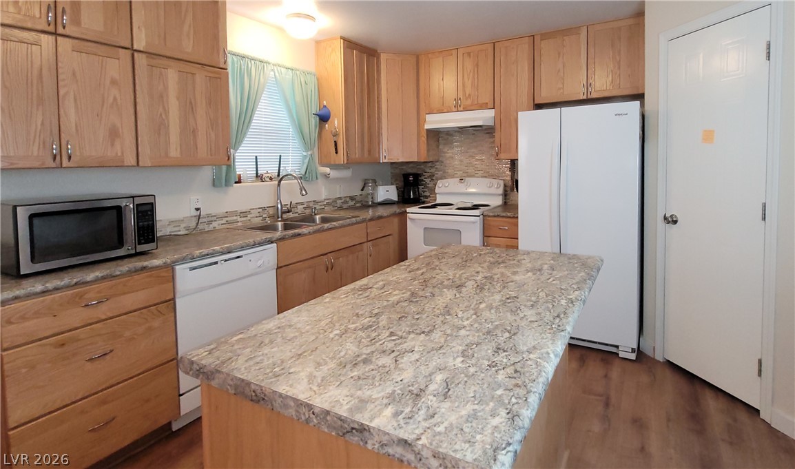 2586 South Miner Road Amargosa Valley, NV 89020 - Photo 7 of 10 A well-equipped kitchen features a functional island and abundant light wood cabinetry.