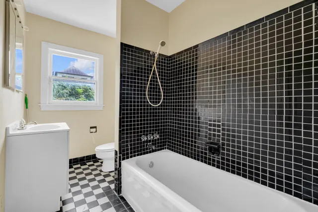 a bathroom with a bathtub and a shower