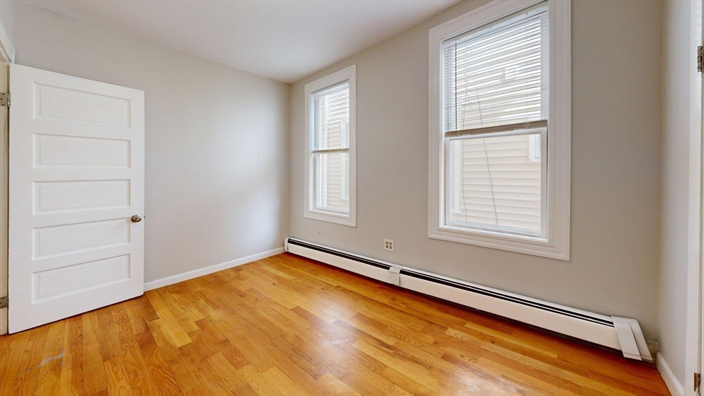 205 Chelsea Street, Unit 3 Boston, MA 02128 - Photo 25 of 33 an empty room with window