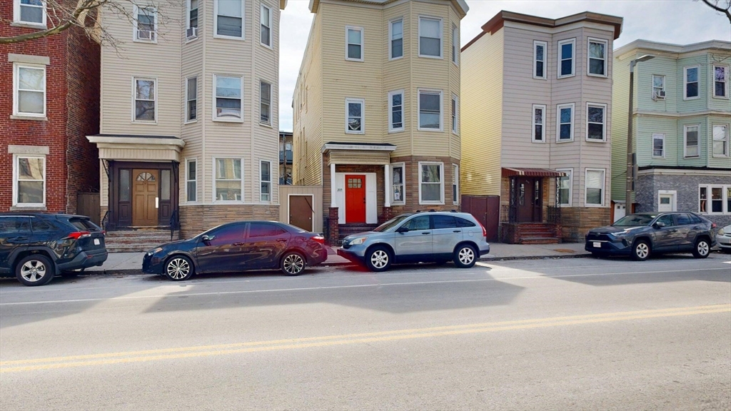 205 Chelsea Street, Unit 3 Boston, MA 02128 - Photo 29 of 33 a cars parked in front of a buildings