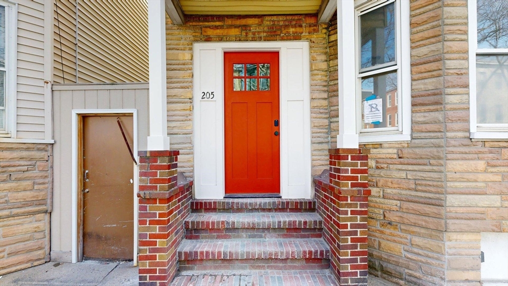 205 Chelsea Street, Unit 3 Boston, MA 02128 - Photo 30 of 33 a view of front door of house with stairs