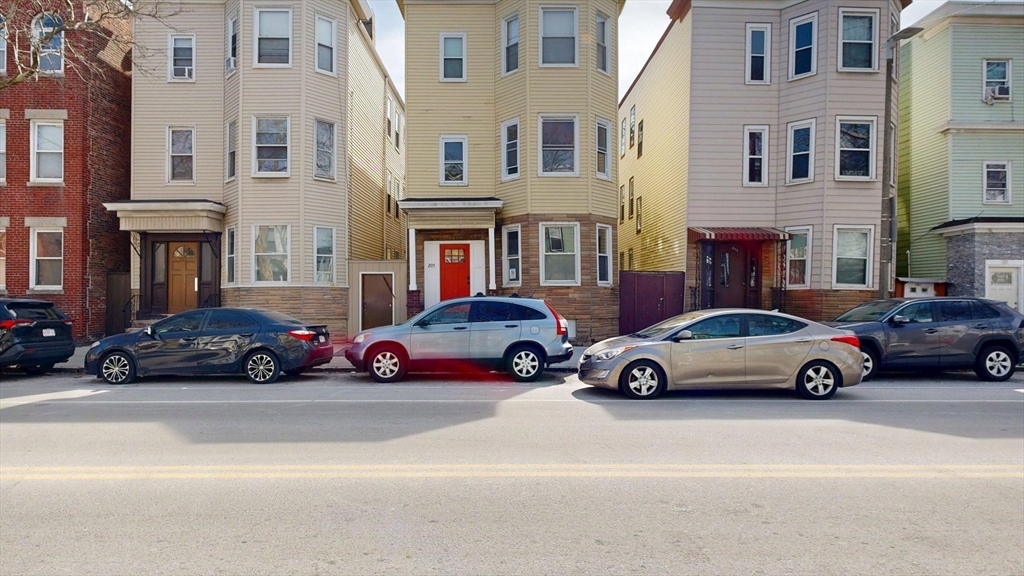 205 Chelsea Street, Unit 3 Boston, MA 02128 - Photo 31 of 33 a view of a cars is parked in front of a building