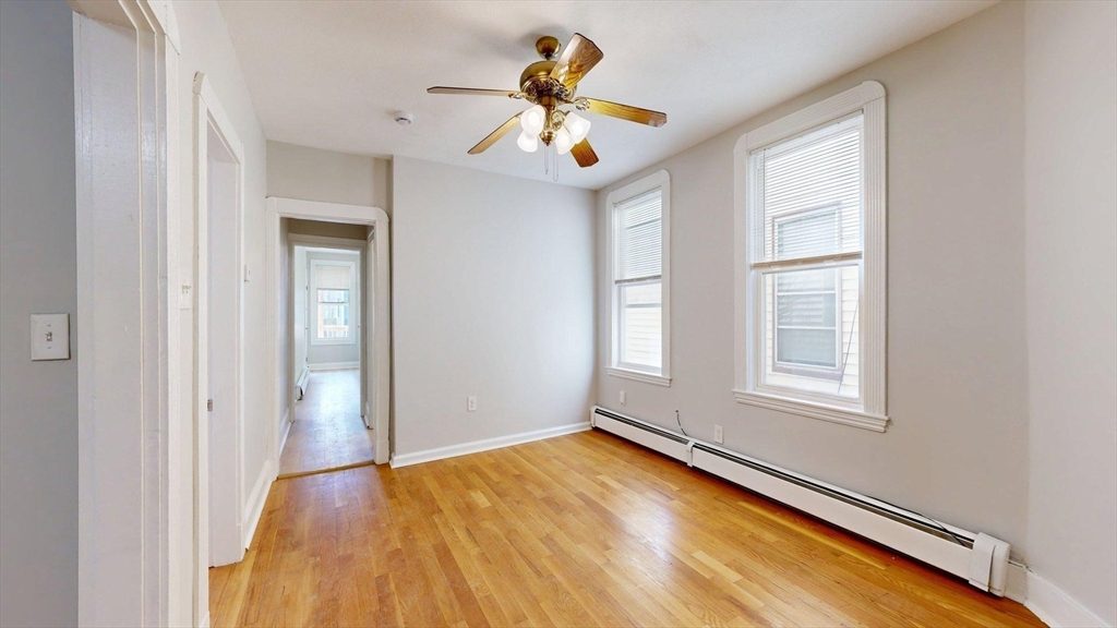 205 Chelsea Street, Unit 3 Boston, MA 02128 - Photo 4 of 33 a view of empty room with window