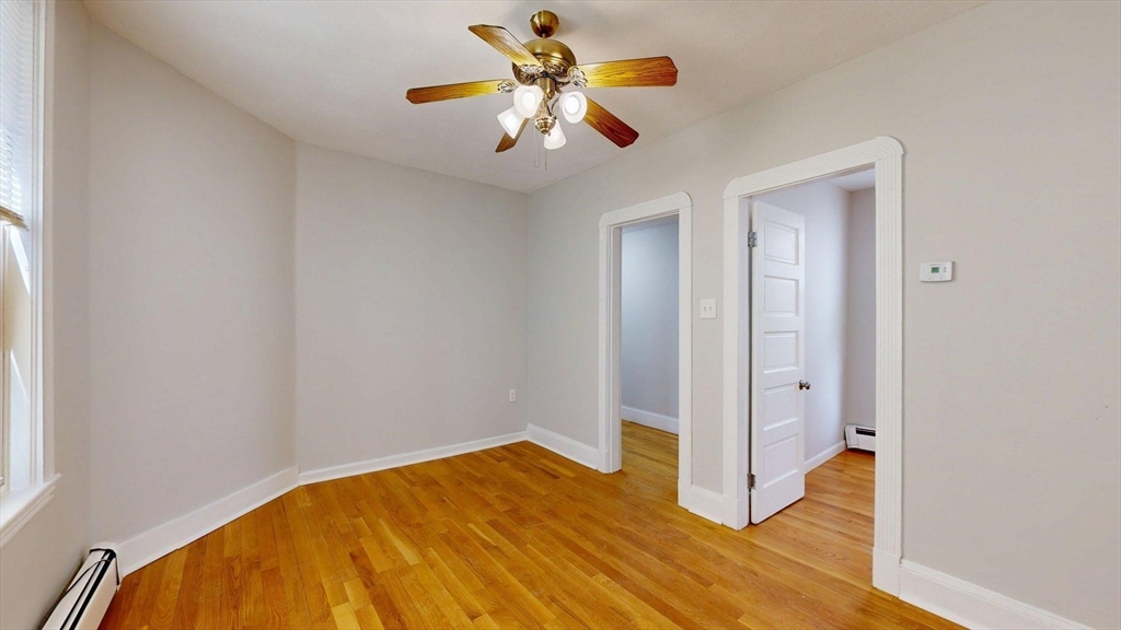 205 Chelsea Street, Unit 3 Boston, MA 02128 - Photo 5 of 33 a view of empty room with wooden floor