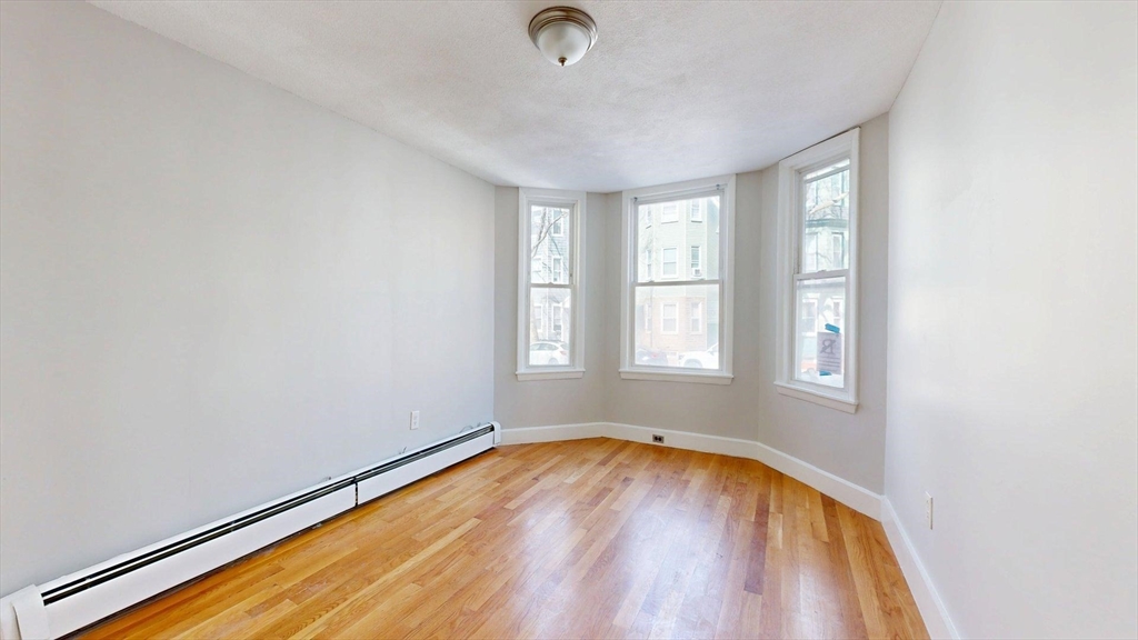 205 Chelsea Street, Unit 3 Boston, MA 02128 - Photo 7 of 33 an empty room with a window