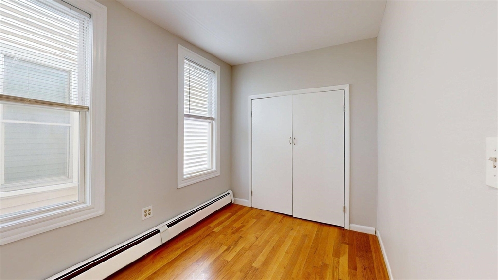 205 Chelsea Street, Unit 3 Boston, MA 02128 - Photo 9 of 33 a view of an empty room and window