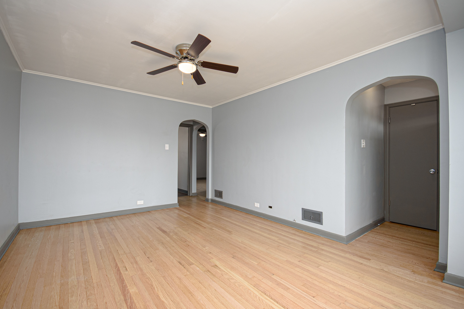 5533 South Menard Avenue Chicago, IL 60638 - Photo 17 of 26 a view of an empty room with wooden floor