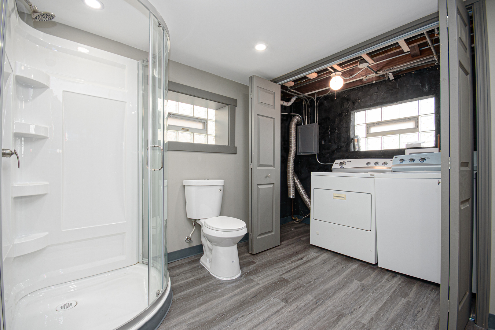 5533 South Menard Avenue Chicago, IL 60638 - Photo 19 of 26 a bathroom with a toilet sink a vanity and shower