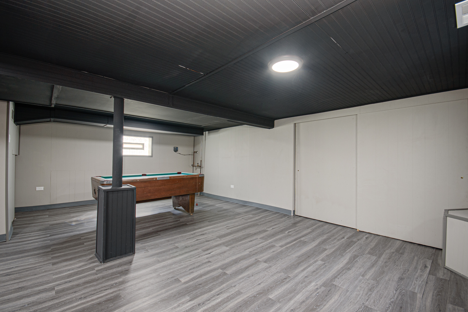 5533 South Menard Avenue Chicago, IL 60638 - Photo 22 of 26 a backyard of a house with wooden floor and outdoor seating