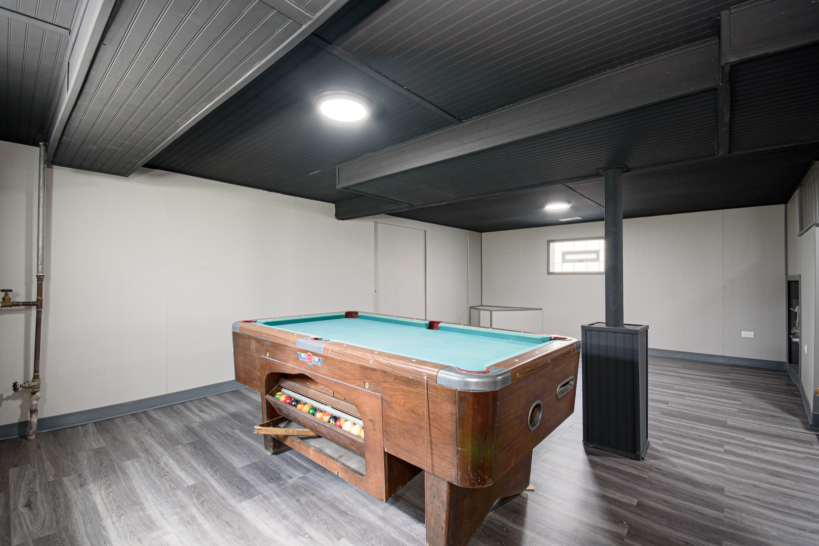5533 South Menard Avenue Chicago, IL 60638 - Photo 24 of 26 a room with pool table and wooden floor