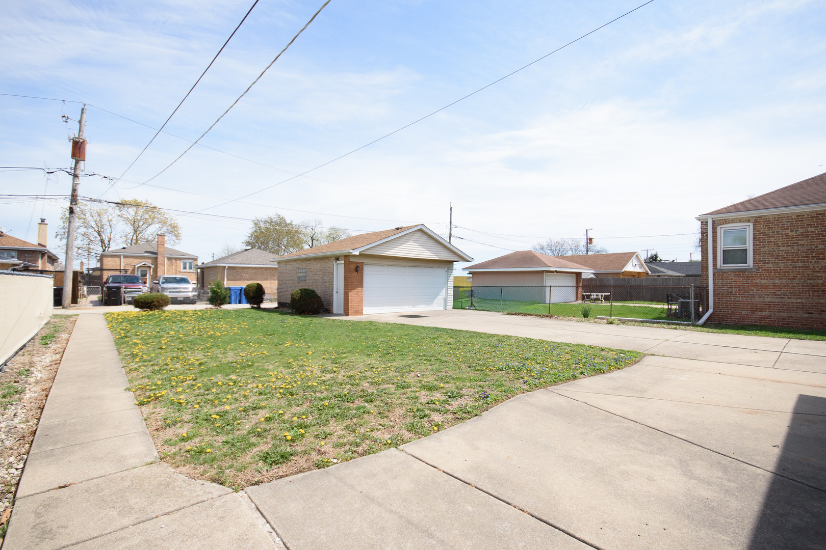 5533 South Menard Avenue Chicago, IL 60638 - Photo 6 of 26 a front view of a house with a yard