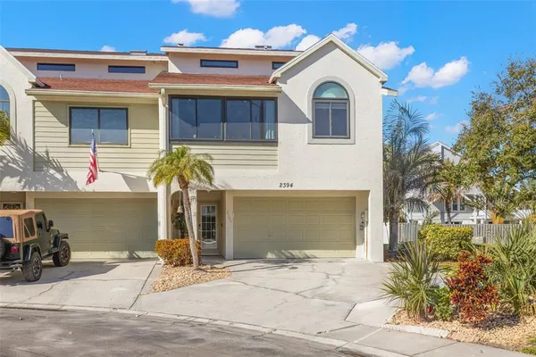 a view of a house with a yard and garage