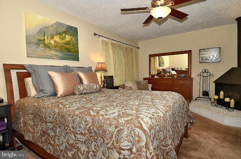 2368 Southgate Square Reston, VA 20191 - Photo 12 of 23 a bedroom with a bed and a chandelier