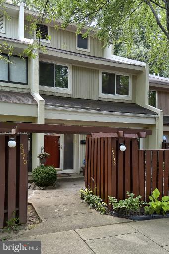 2368 Southgate Square Reston, VA 20191 - Photo 15 of 23 a front view of a house with garden
