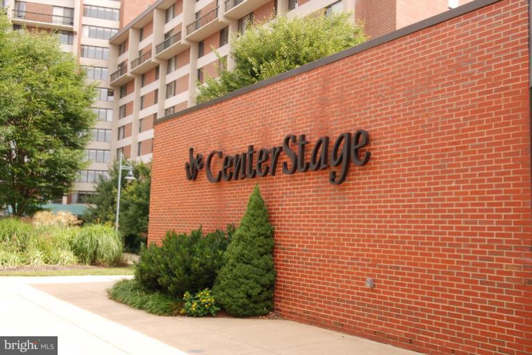 2368 Southgate Square Reston, VA 20191 - Photo 16 of 23 a street sign on a wall next to a building