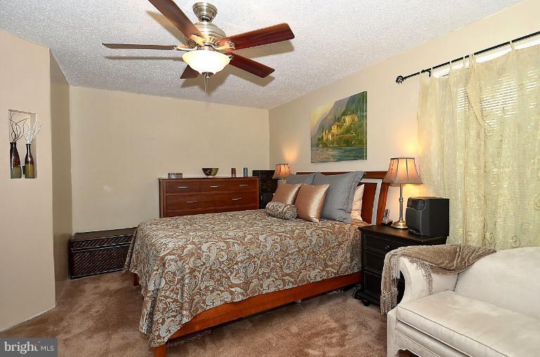 2368 Southgate Square Reston, VA 20191 - Photo 22 of 23 a bedroom with a bed couch and window