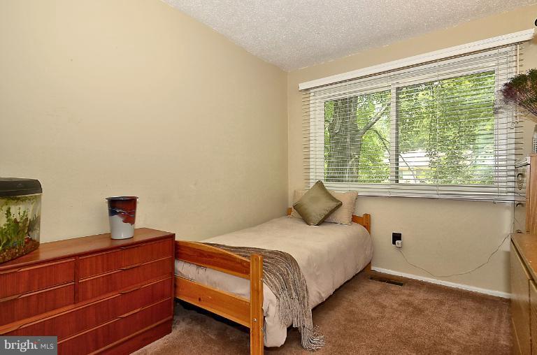 2368 Southgate Square Reston, VA 20191 - Photo 4 of 23 a bedroom with a bed and a window