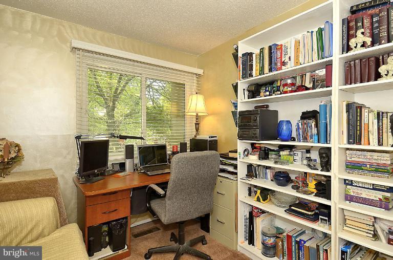 2368 Southgate Square Reston, VA 20191 - Photo 9 of 23 a work room with furniture bookshelf and a window