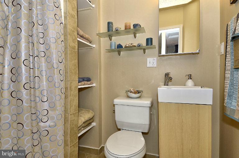 2368 Southgate Square Reston, VA 20191 - Photo 10 of 23 a white toilet sitting next to a bathroom sink