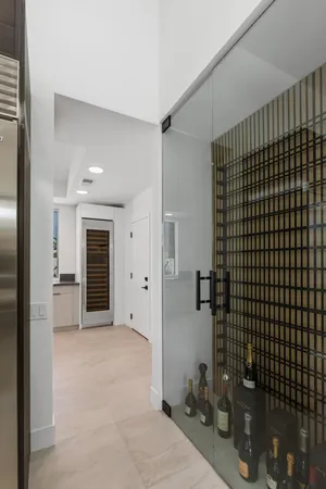 a kitchen with a sink and a washer dryer