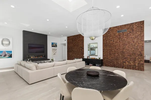 a living room with fireplace furniture and a flat screen tv