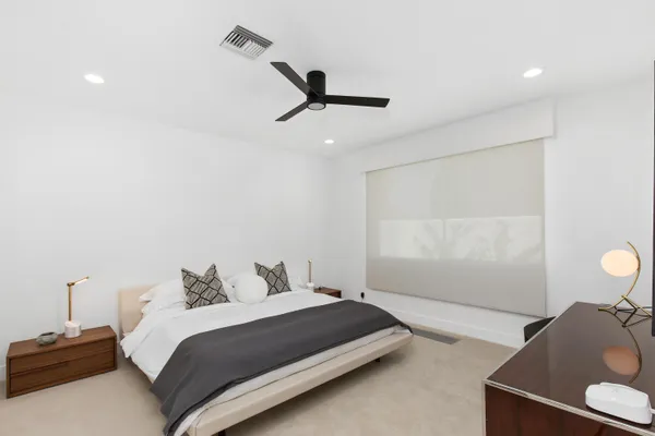 a bedroom with a bed and a fireplace