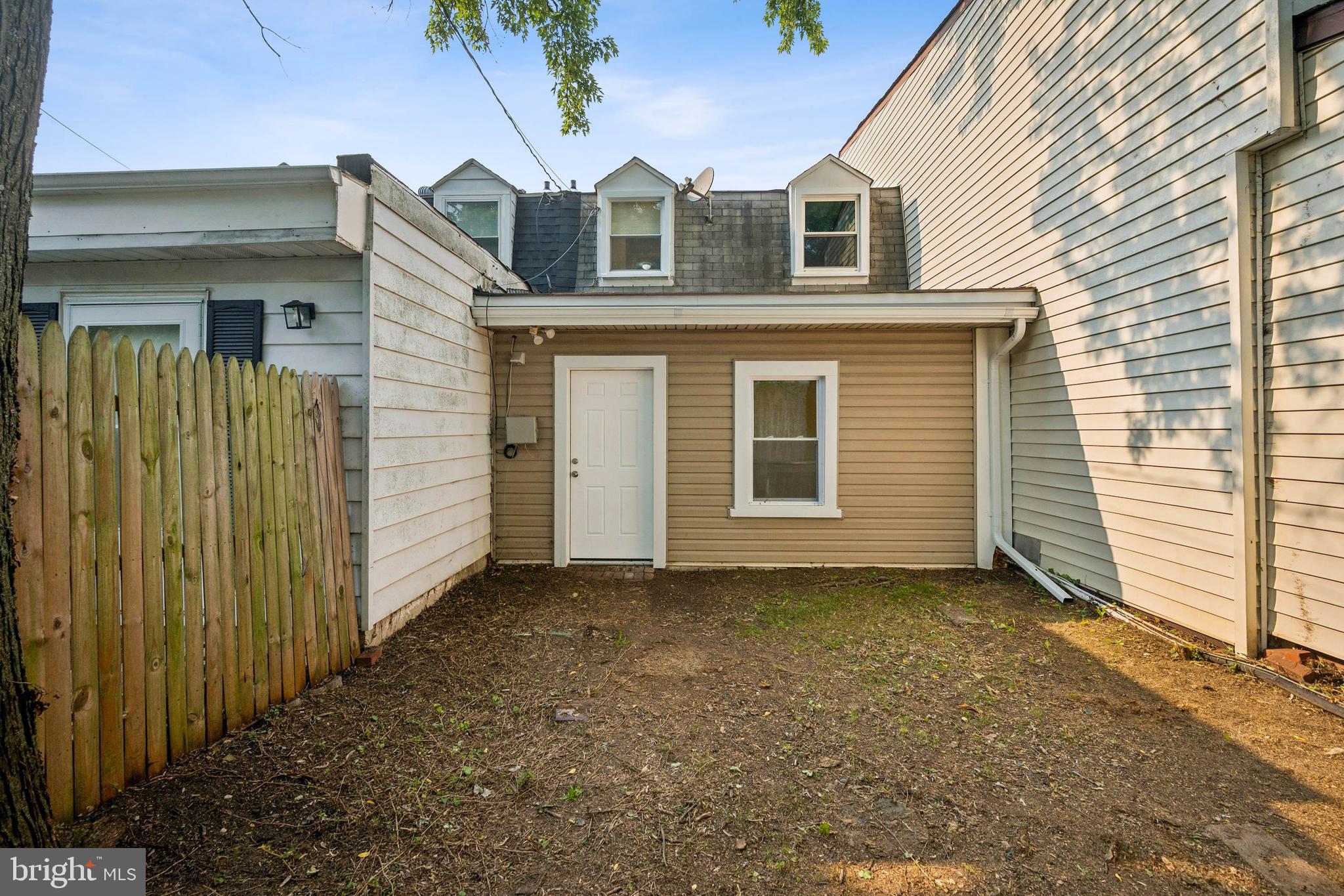 7227 Sindall Road Baltimore, MD 21234 - Photo 51 of 62 a front view of a house with a yard