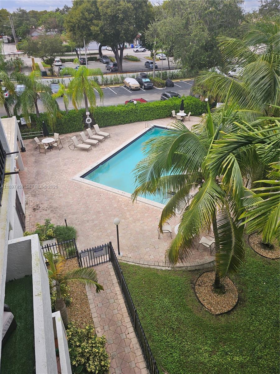 2150 Southwest 16th Avenue, Unit 406 Miami, FL 33145 - Photo 22 of 23 a view of a swimming pool with a yard