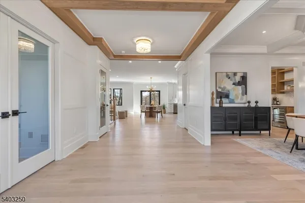 a view of a dining room with furniture and chandelier
