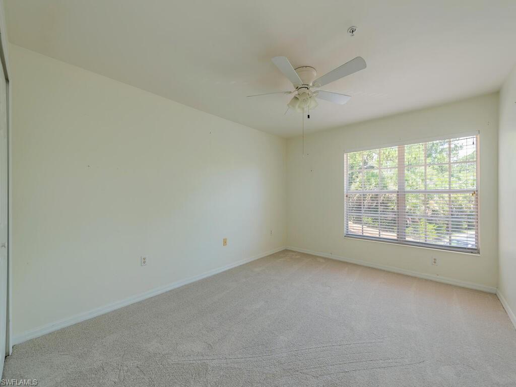 1280 Henley Street, Unit 1601 Naples, FL 34105 - Photo 9 of 15 Carpeted spare room featuring ceiling fan