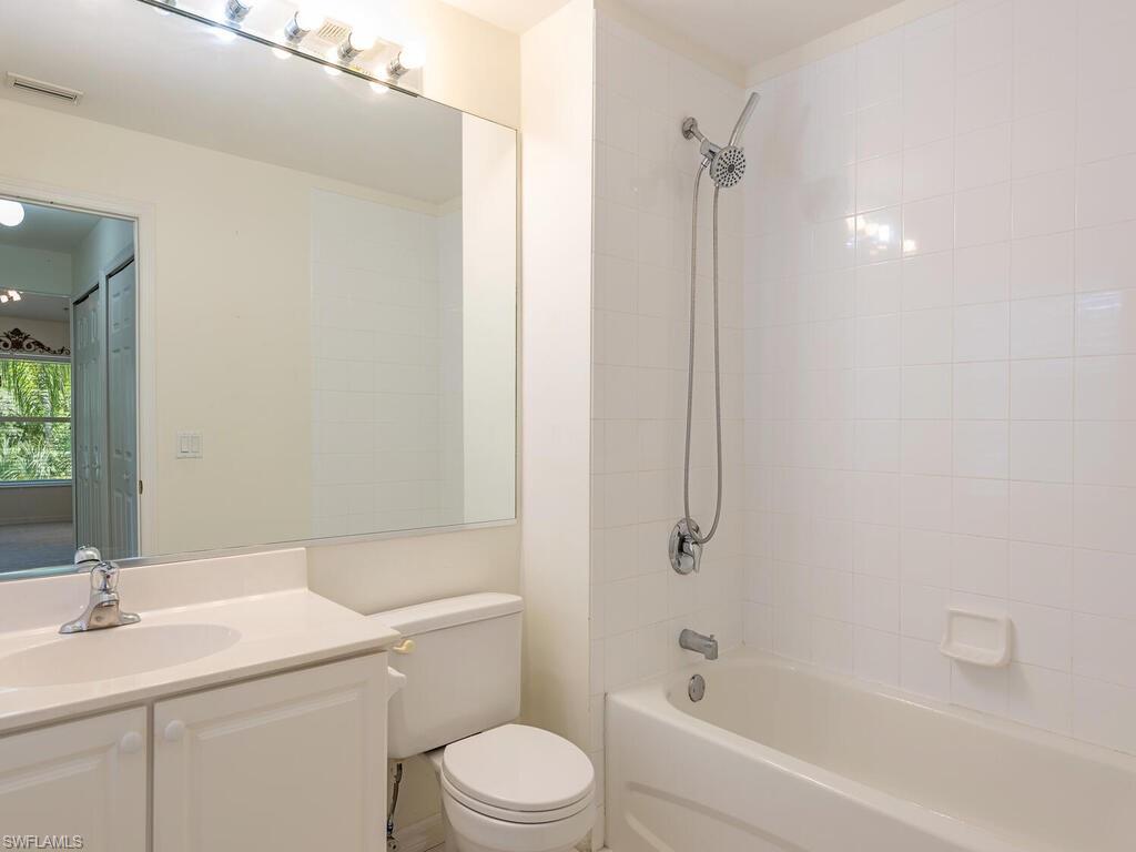 1280 Henley Street, Unit 1601 Naples, FL 34105 - Photo 10 of 15 Full bathroom with toilet, tiled shower / bath combo, and vanity