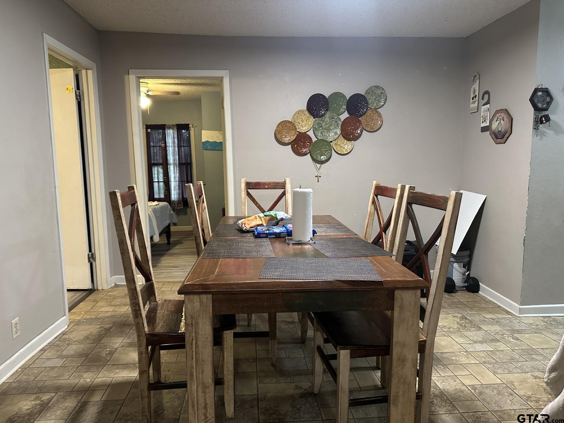 6287 County Road 334 Tyler, TX 75708 - Photo 7 of 8 a view of a dining room with furniture and wooden floor