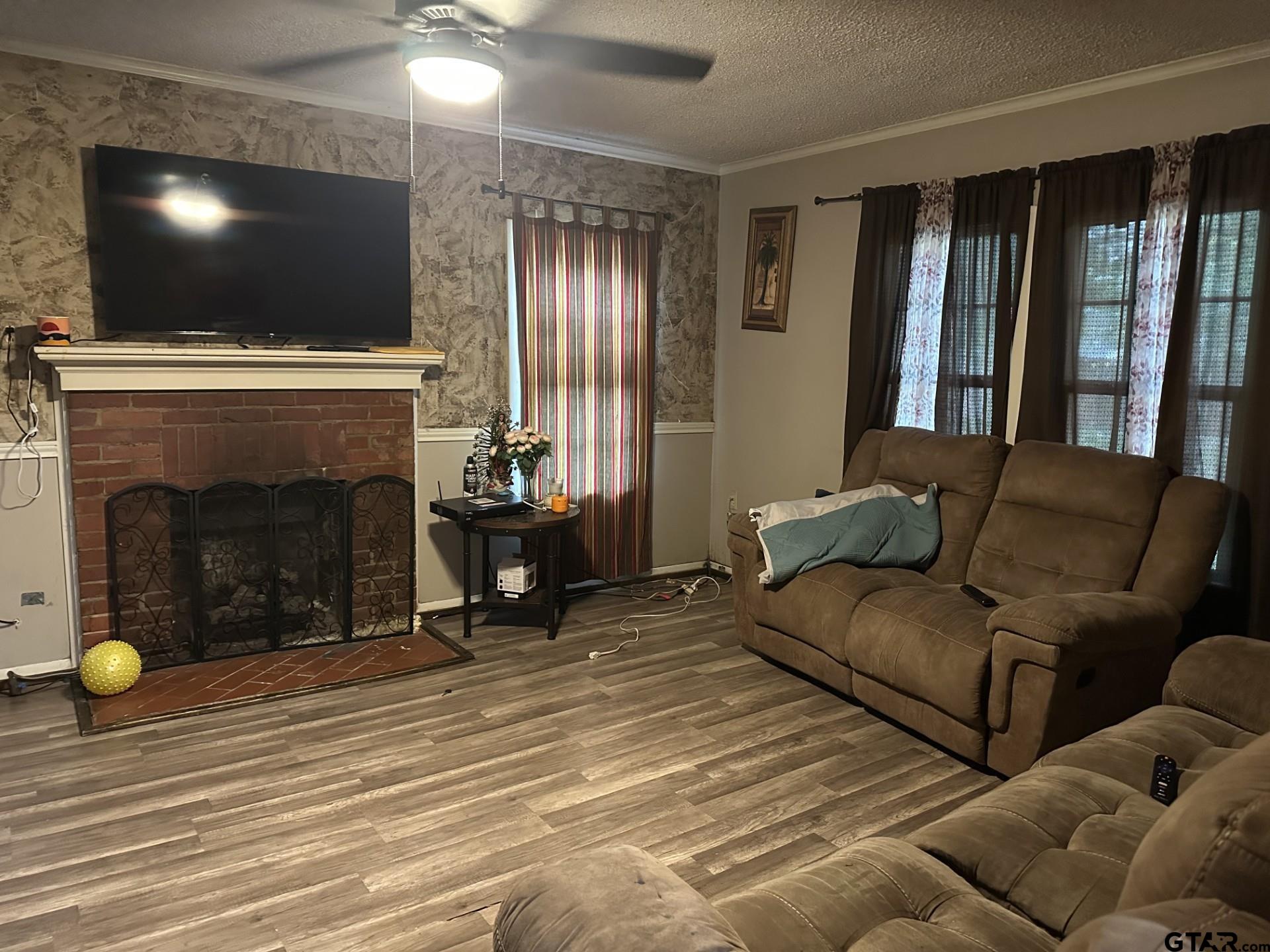 6287 County Road 334 Tyler, TX 75708 - Photo 8 of 8 a living room with furniture and a flat screen tv