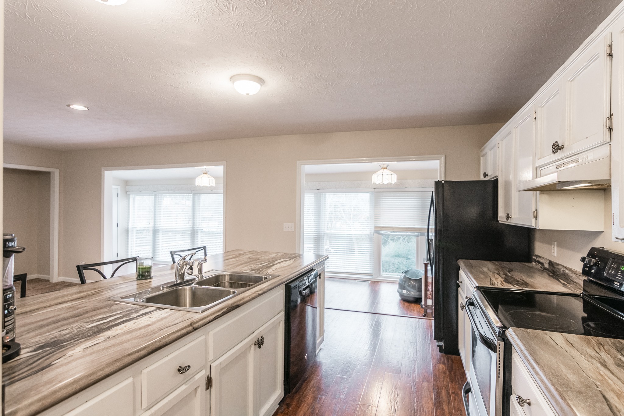 1005 Edgewater Circle Gallatin, TN 37066 - Photo 12 of 50 a kitchen with stainless steel appliances granite countertop a sink stove and refrigerator