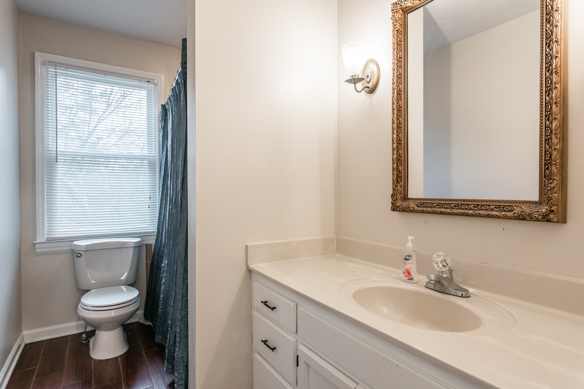 1005 Edgewater Circle Gallatin, TN 37066 - Photo 20 of 50 a bathroom with a toilet sink and mirror