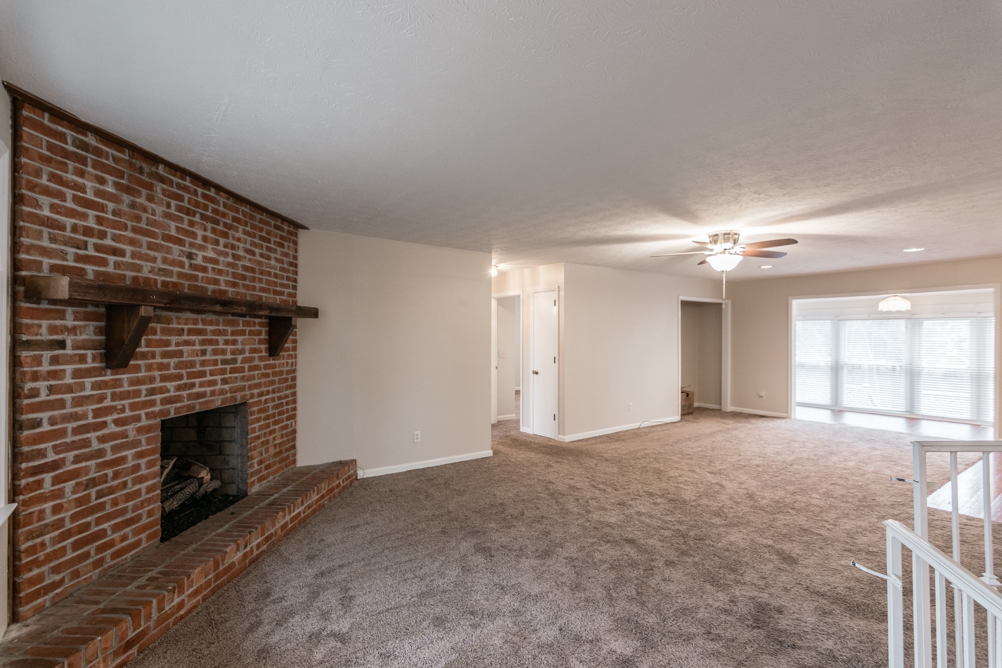 1005 Edgewater Circle Gallatin, TN 37066 - Photo 5 of 50 an empty room with windows and fireplace