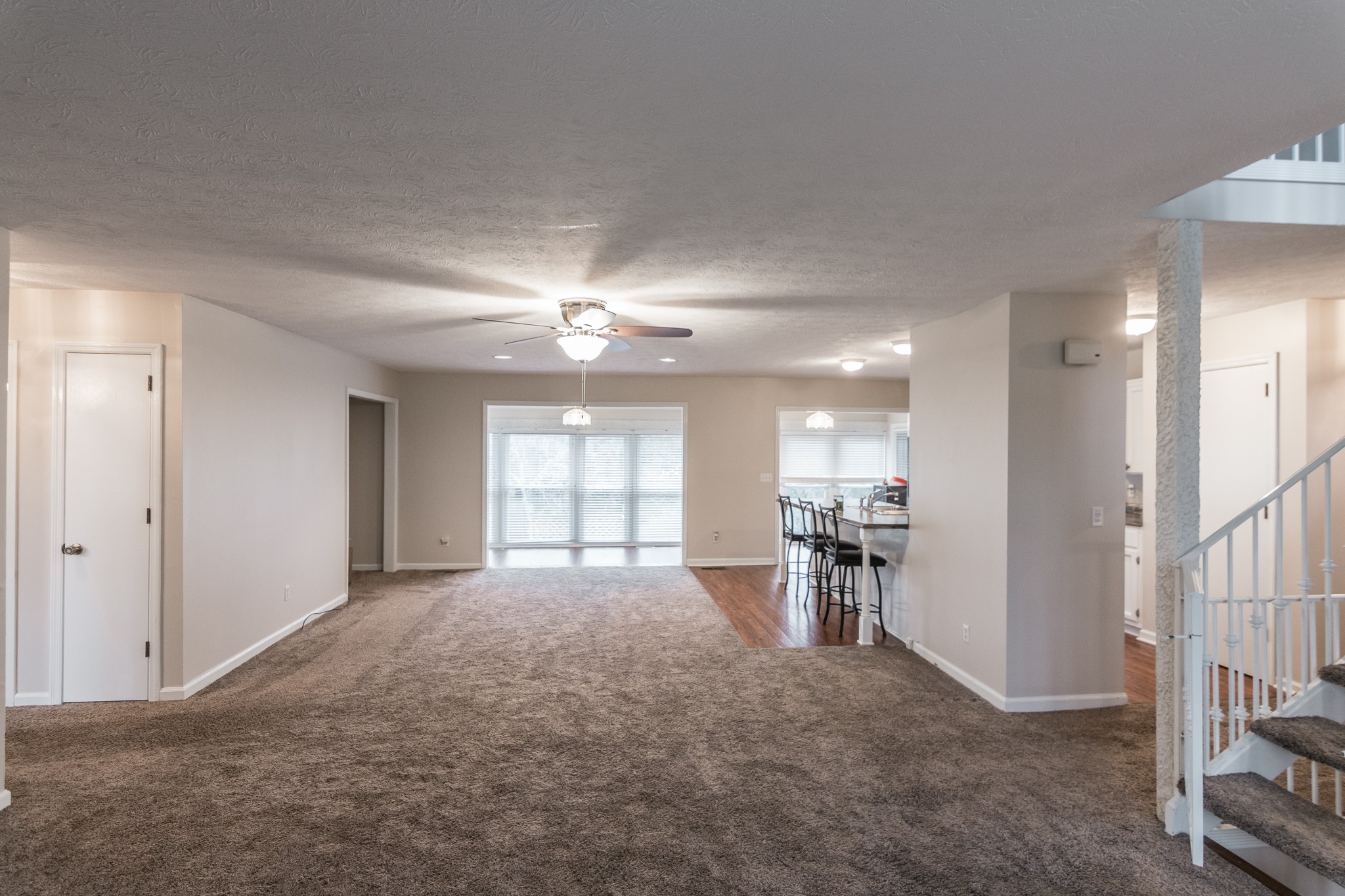 1005 Edgewater Circle Gallatin, TN 37066 - Photo 6 of 50 an empty room with a kitchen and windows