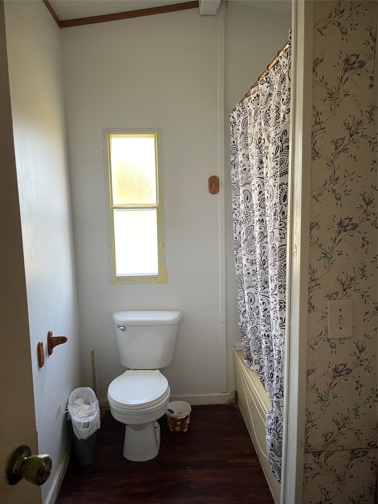 59 Wallace Road Huntsville, TX 77320 - Photo 13 of 16 a bathroom with a toilet and a shower curtain