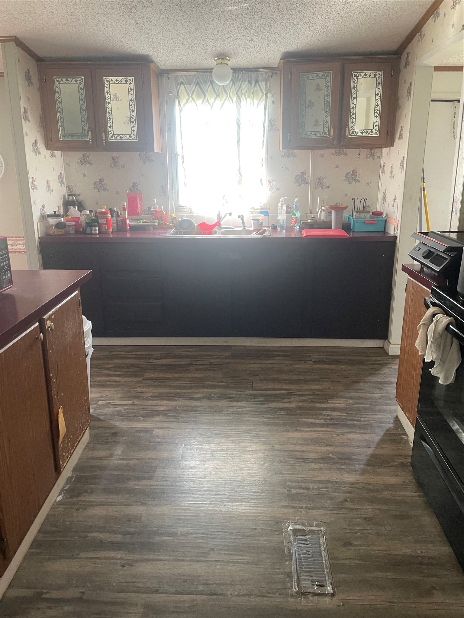 59 Wallace Road Huntsville, TX 77320 - Photo 4 of 16 a kitchen with a sink and cabinets