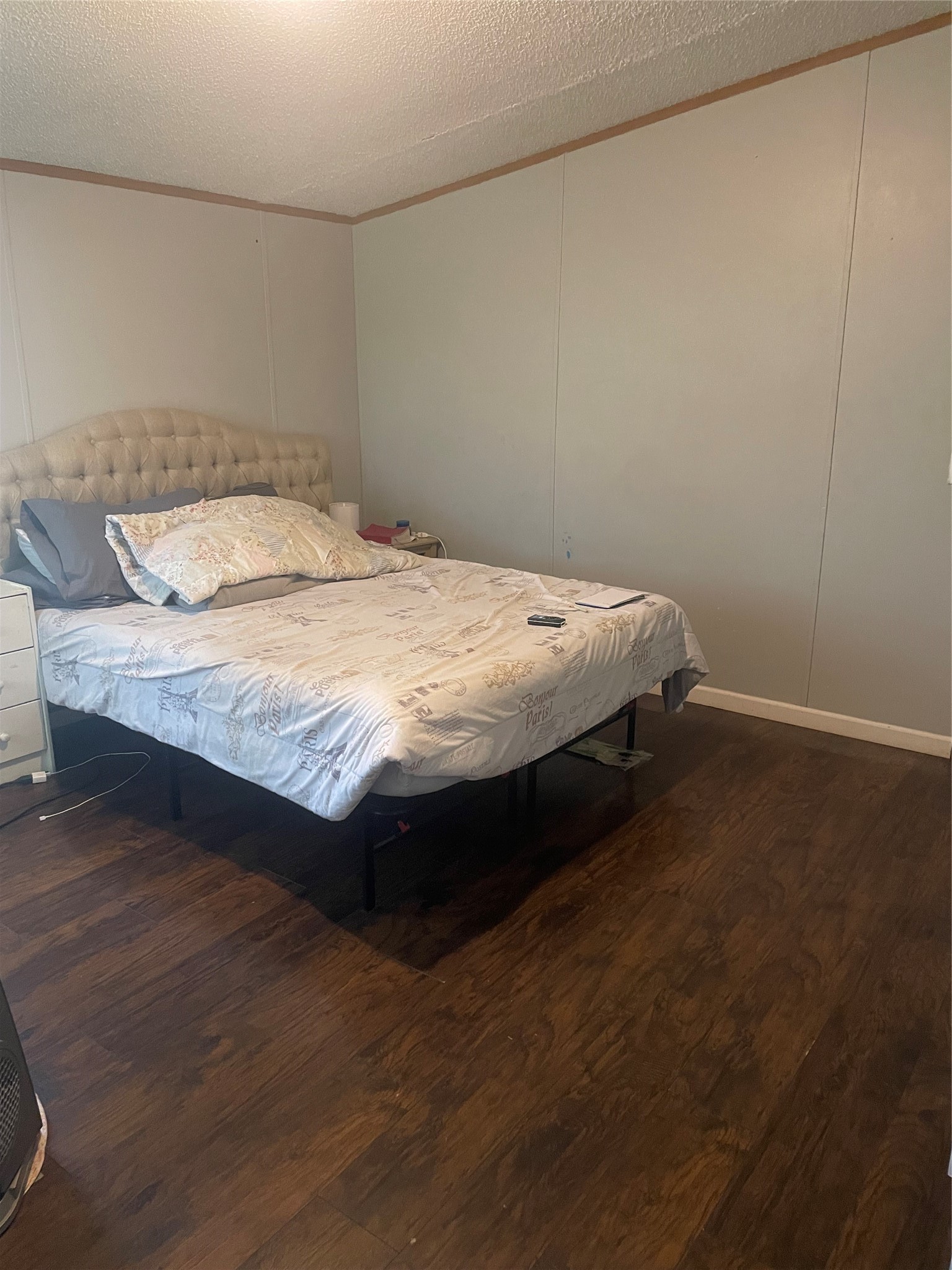 59 Wallace Road Huntsville, TX 77320 - Photo 7 of 16 a bedroom with a bed and wooden floor