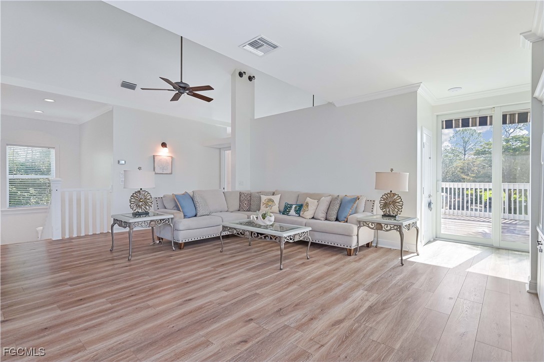 6941 Hunters Road Naples, FL 34109 - Photo 29 of 45 a living room with furniture and wooden floor