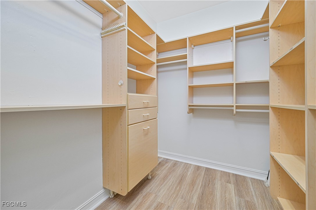 6941 Hunters Road Naples, FL 34109 - Photo 37 of 45 a view of an empty walk in closet