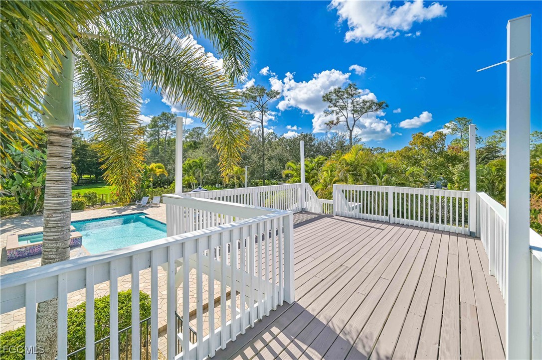 6941 Hunters Road Naples, FL 34109 - Photo 43 of 45 a view of a balcony with wooden floor